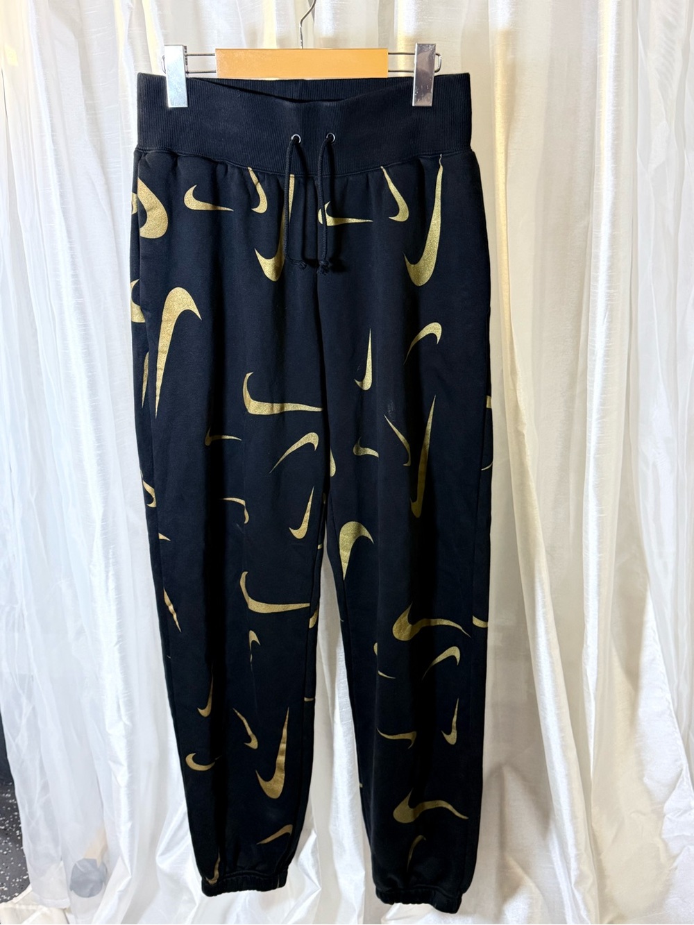 Nike Black Joggers with Gold Swoosh Print